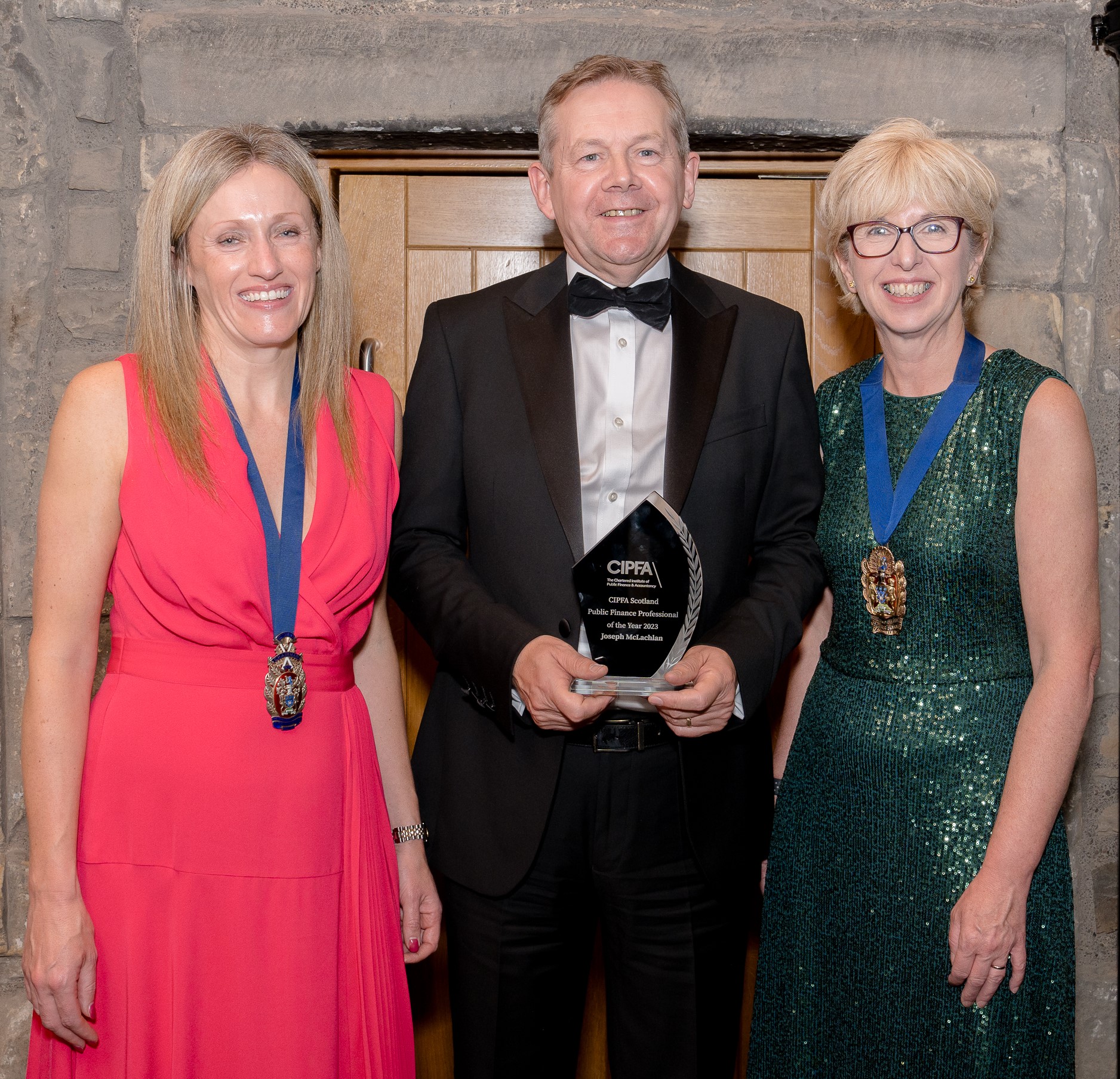 Finance Professional of the Year award winner Joseph McLachlan standing between Caroline Rassell CIPFA President and Jo Brown CIPFA Scotland Branch Chair