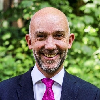 Headshot of Adrian Crompton